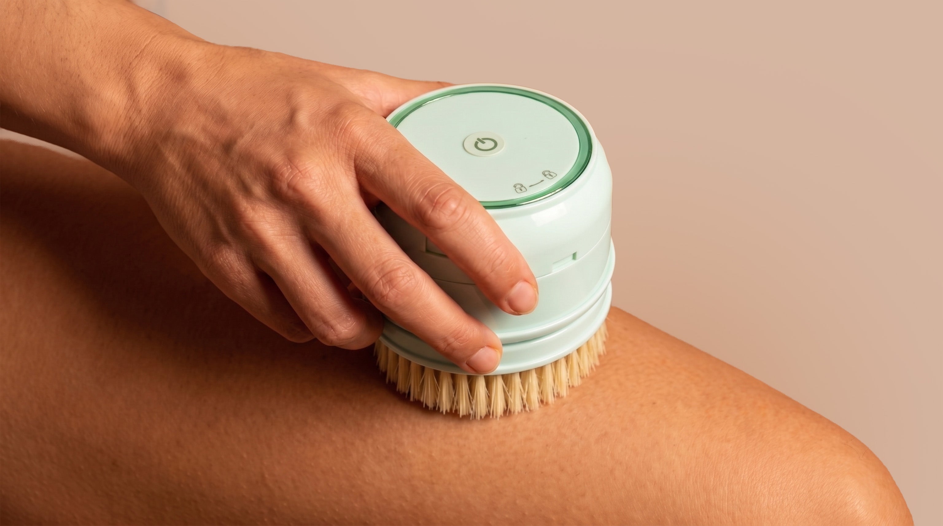 rollerstone electric dry body brush used on leg for dry brushing care
