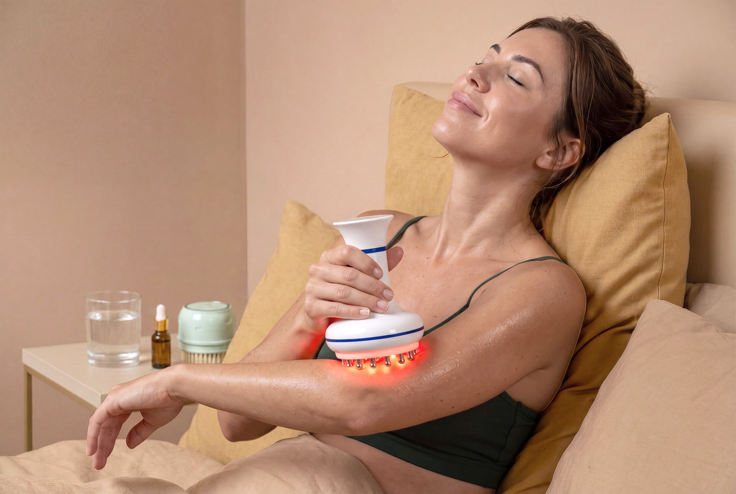 woman using a rollerstone lymphatic drainage massager at home for a simple spa-inspired care routine
