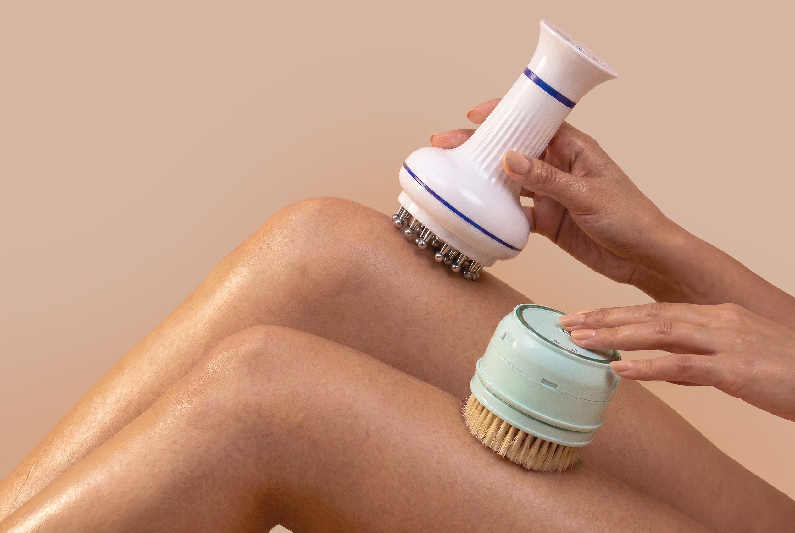 rollerstone electric dry body brush and lymphatic drainage massager with skin-contact materials used on legs