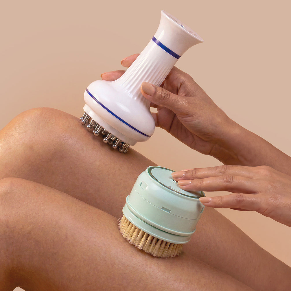 rollerstone electric dry body brush and lymphatic drainage massager with skin-contact materials used on legs