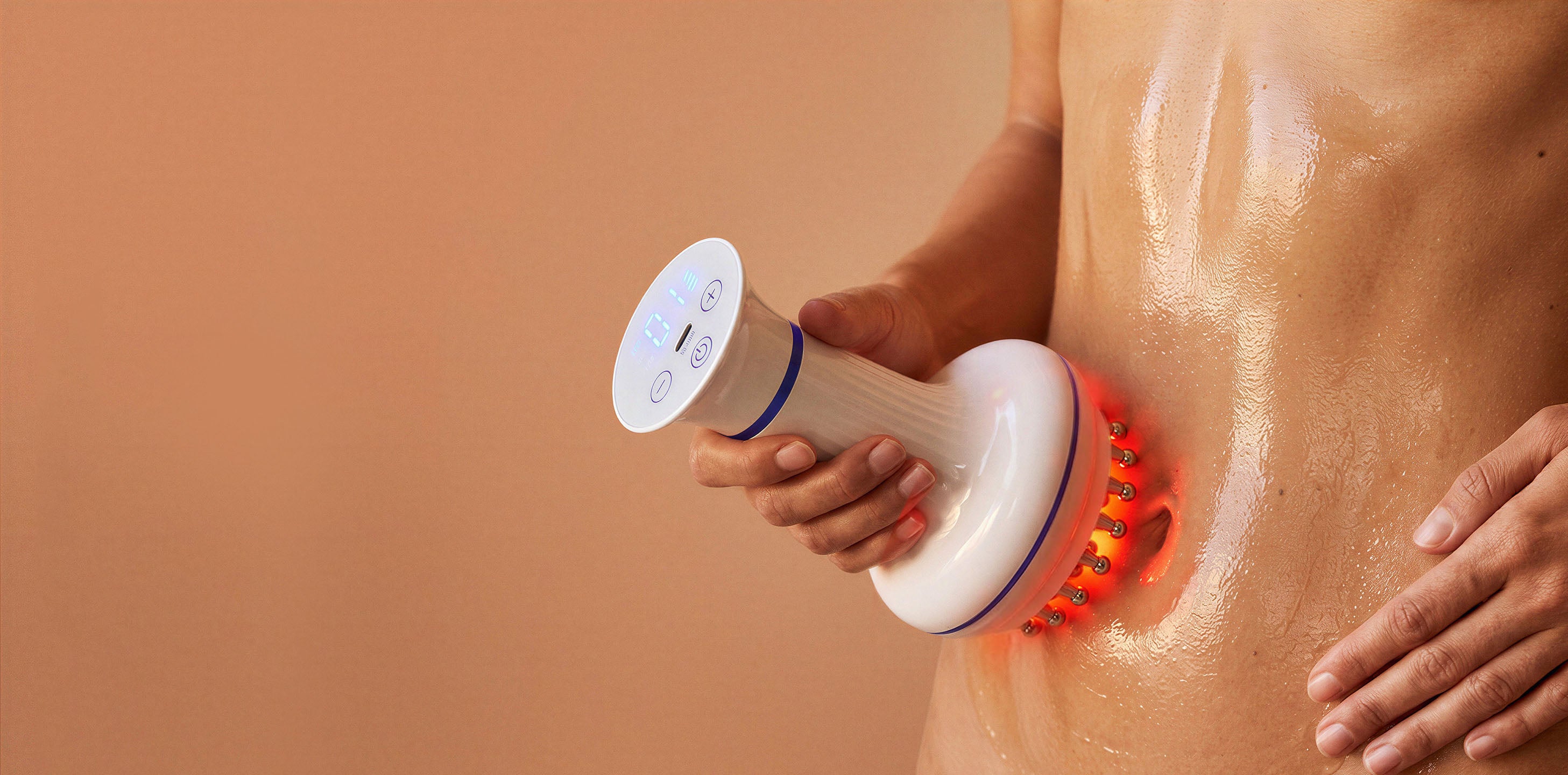rollerstone lymphatic drainage massager with multi-functions, such as heat mode, used on the waist area