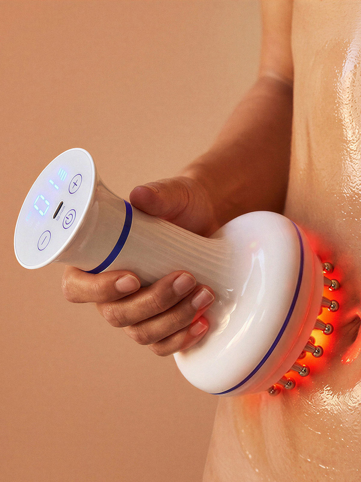 rollerstone lymphatic drainage massager with multi-functions, such as heat mode, used on the waist area